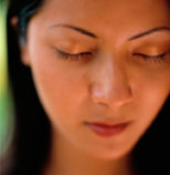 woman with her eyes closed, quietly meditating, Shen Men Feng Shui